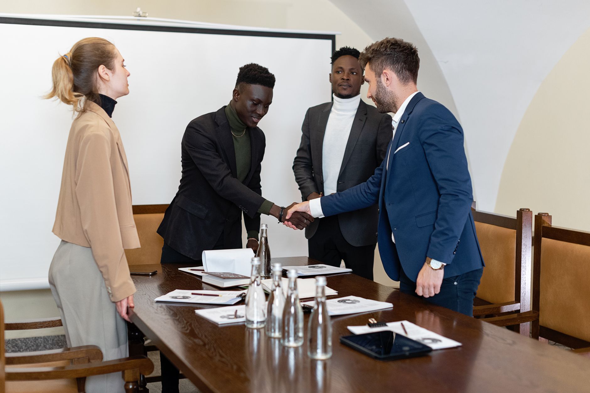 Corporate boardroom negotiators agreeing on complex strategic partnership contracts